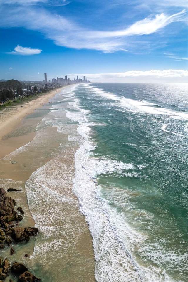 Aerial view of the Gold Coast's beaches curling south along the coastline