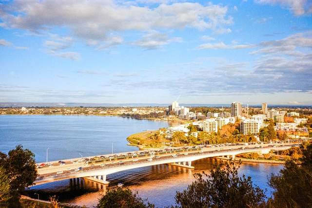 Perth's skyline along the river at dusk