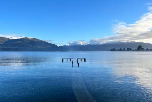 A mountain lake and forested peaks near Te Anau, New Zealand